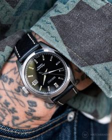 Seiko black sarb033 on textured leather strap pocketshot
