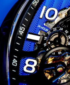 Audaz black and blue watch with skeletonized visible movement close up